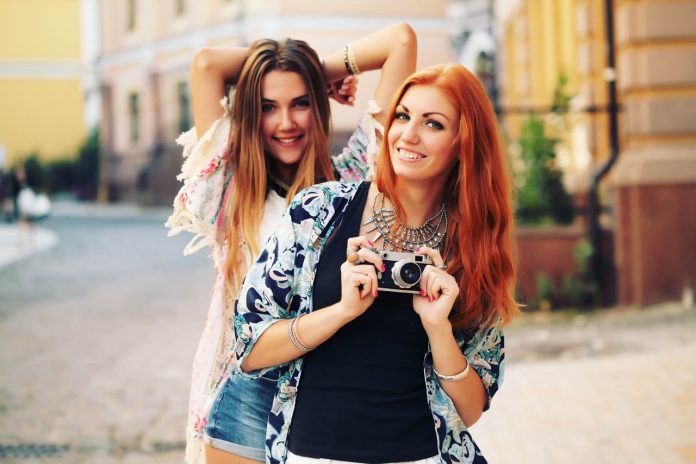 Outdoor,Fall,Smiling,Lifestyle,Portrait,Of,Pretty,Young,Girls,Having